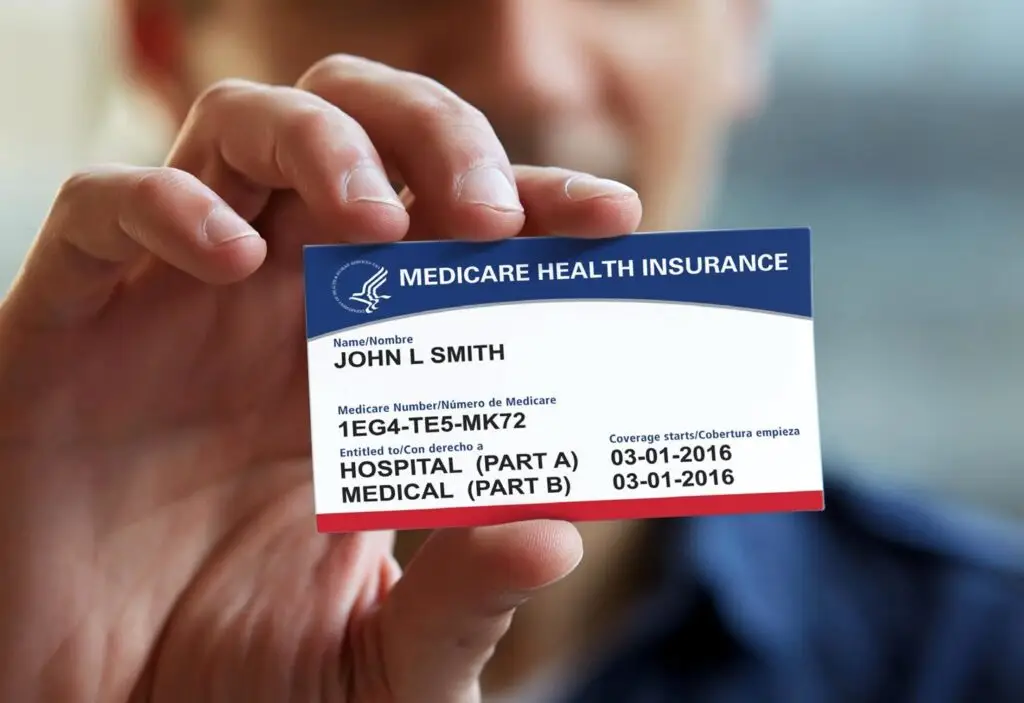 photo of man holding medicare card