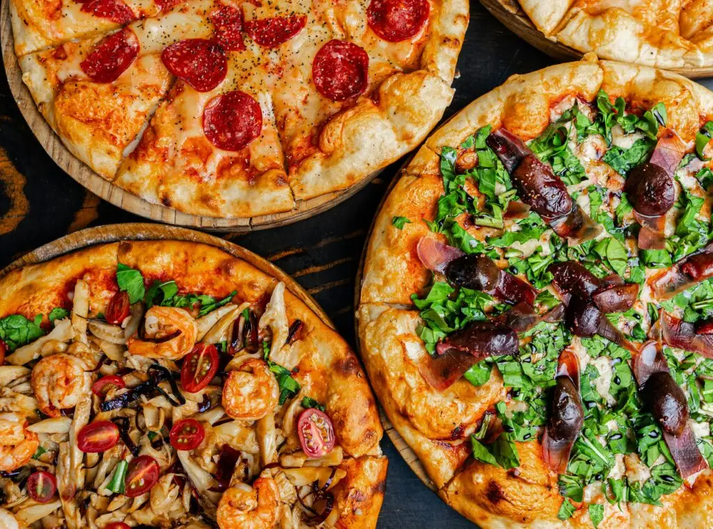 3 pizzas with various toppings