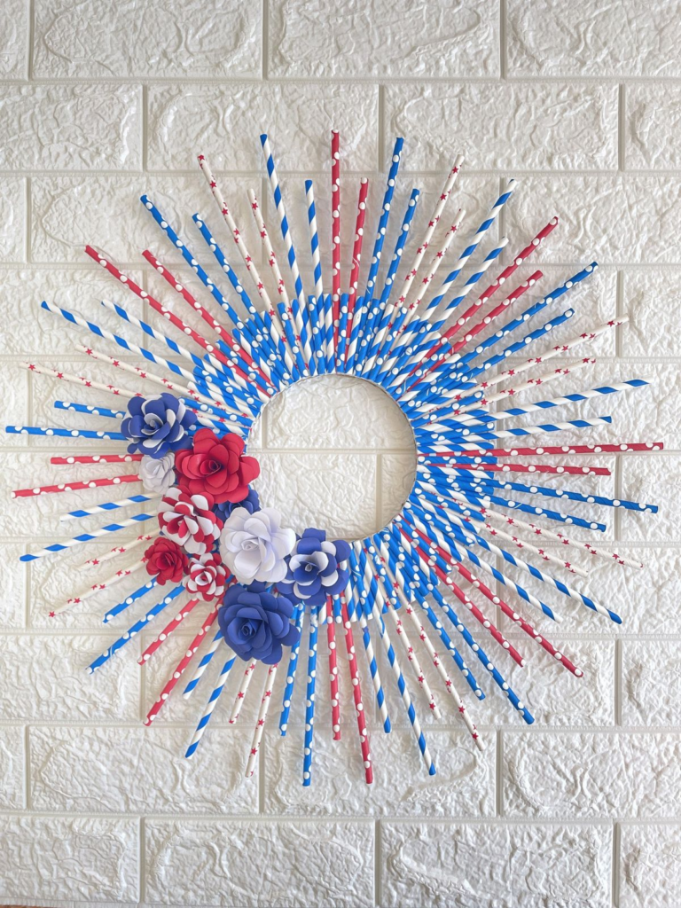 patriotic straw wreath made of re, white and blue straws