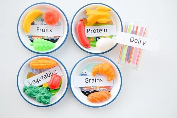 nutrition for kids: bowls of fruits, vegetables, protein, grains, dairy